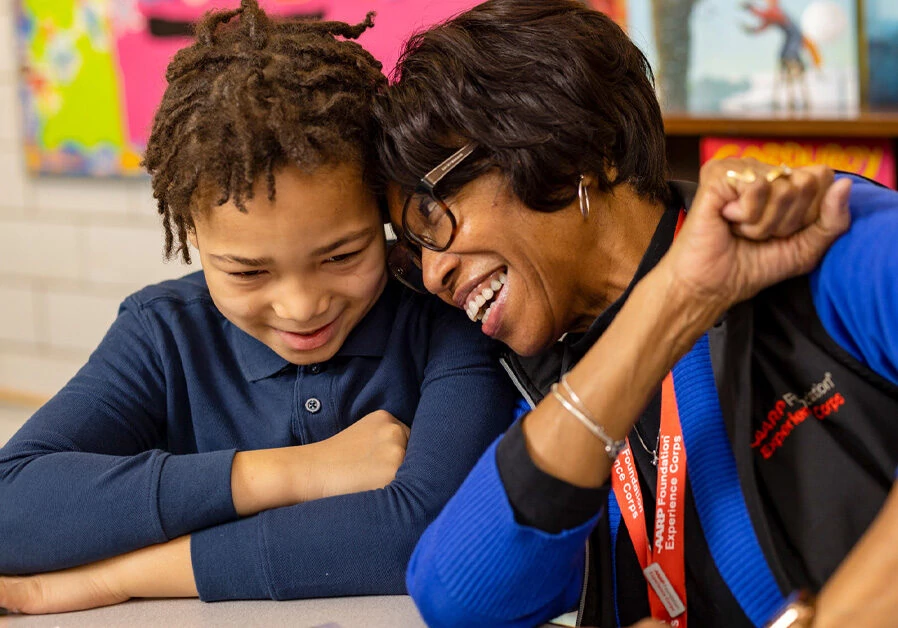 Woman and boy laughing.