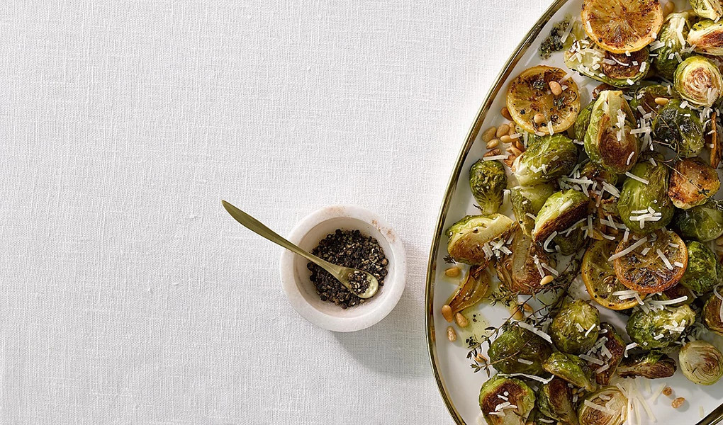 A close-up view of garlic-Parmesan roasted Brussels sprouts on a plate