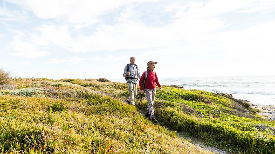 Two seniors hiking