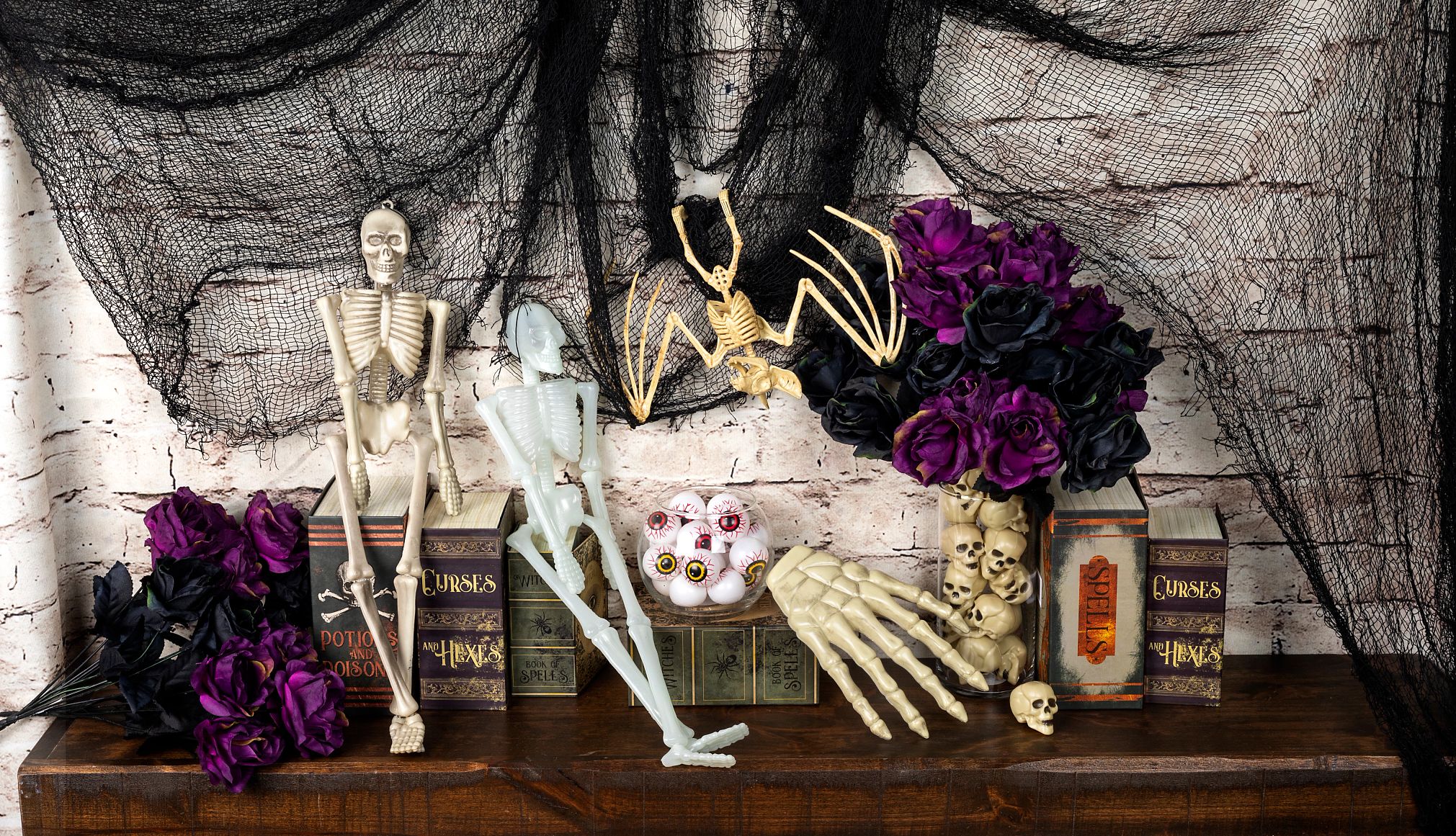 miniature skeletons and a hand on a decorative shelf