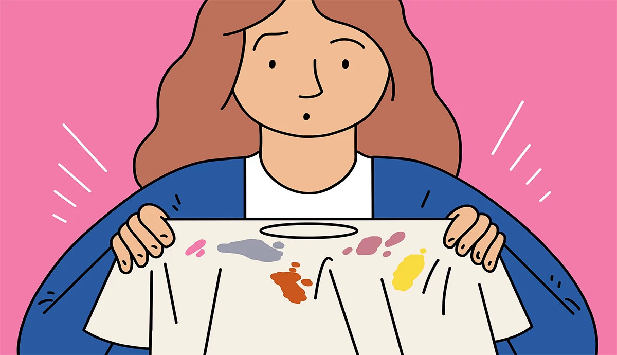 an illustration shows a woman examining a tee shirt with various stains