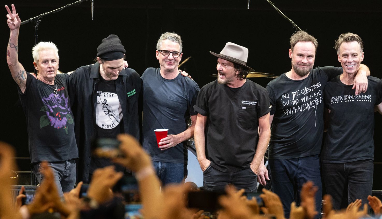 Remembrance of Pearl Jam Mike McCready, Josh Klinghoffer, Stone Gossard, Eddie Vedder, Jeff Ament and Matt Cameron standing in line across stage