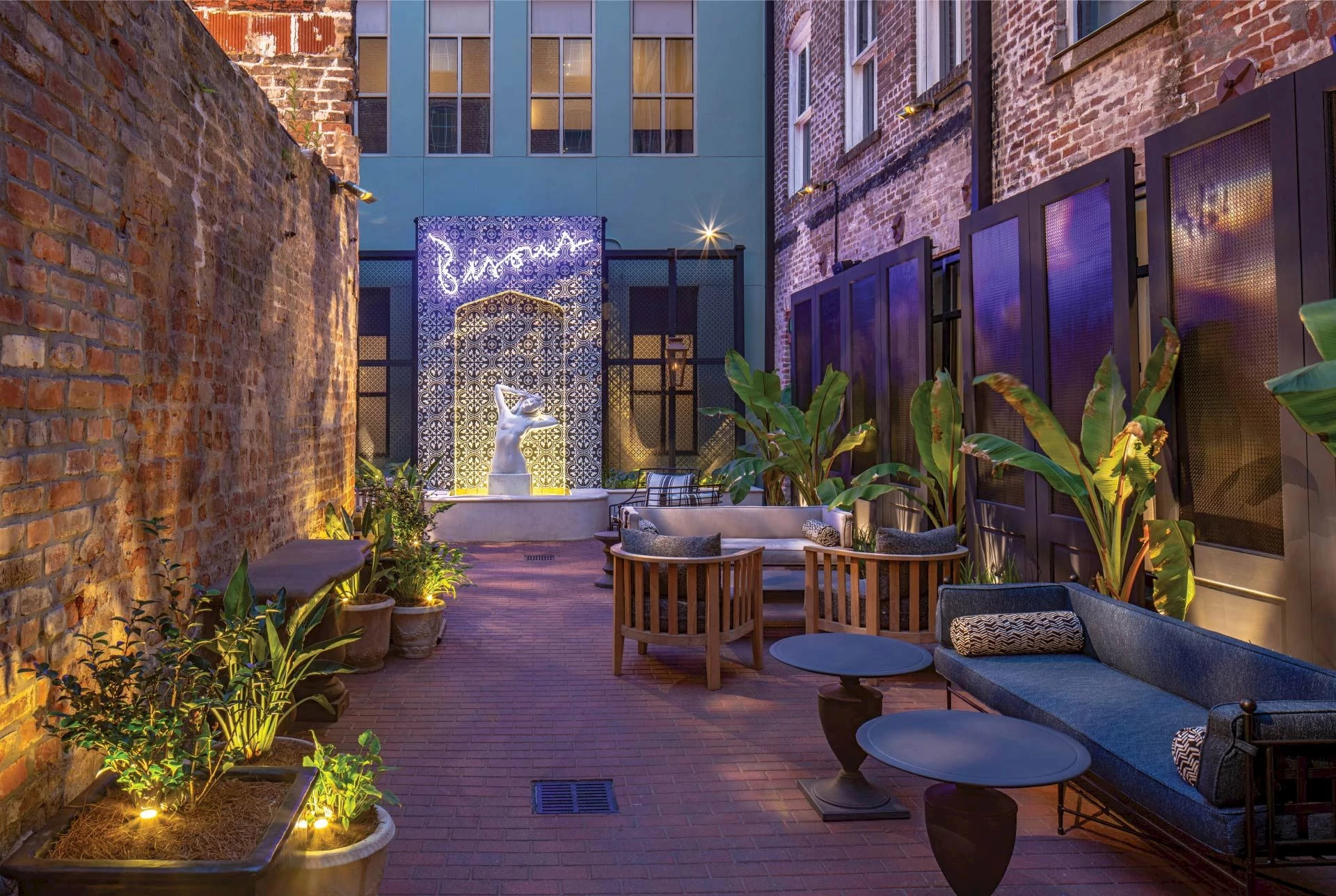 a hotel courtyard with a statue