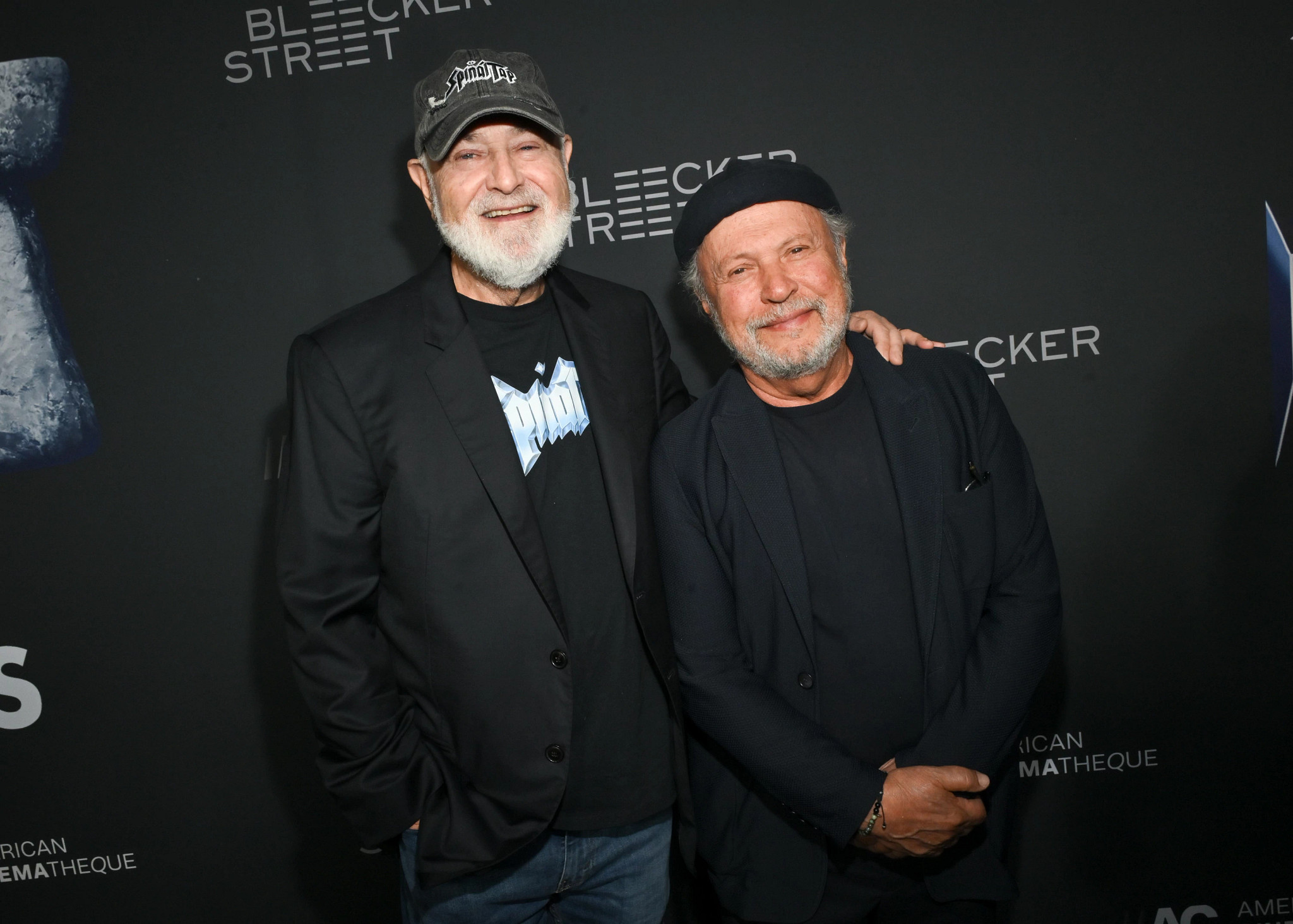 Rob Reiner and Billy Crystal posing together.