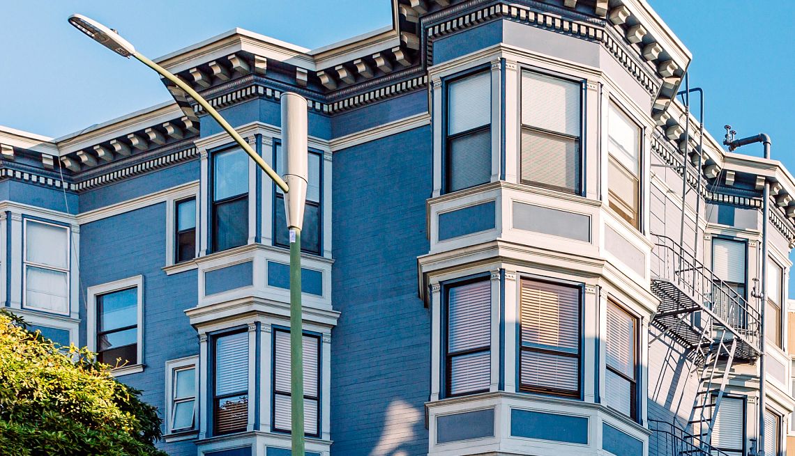 Top 100 Places to Live Residential street with Victorian style apartment buildings on a sunny day, San Francisco