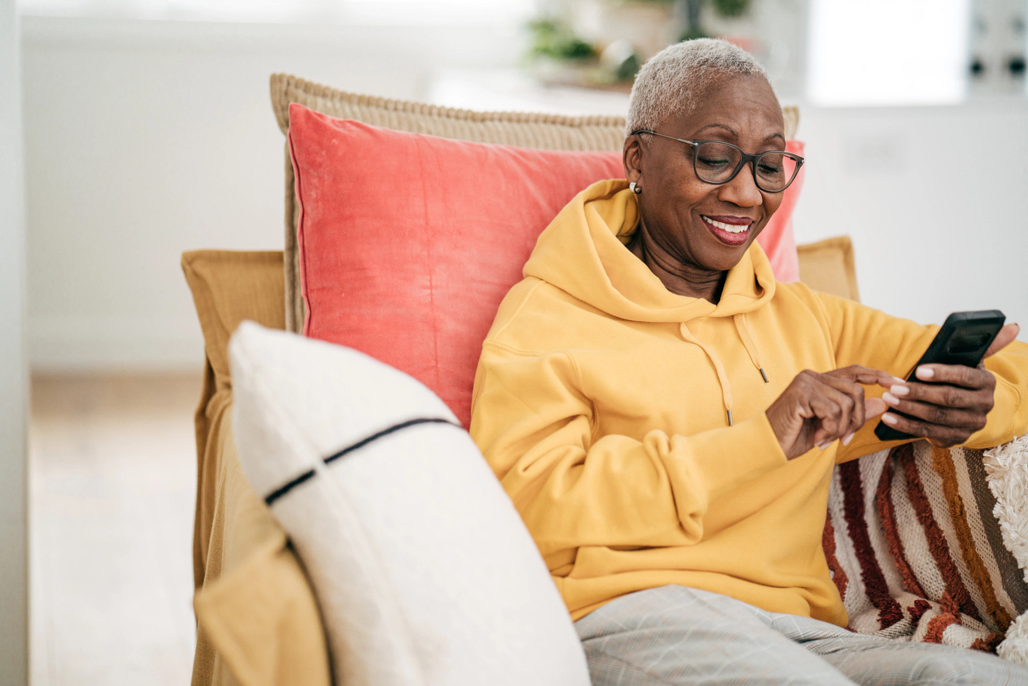 Senior women using cellphone for online health consultation