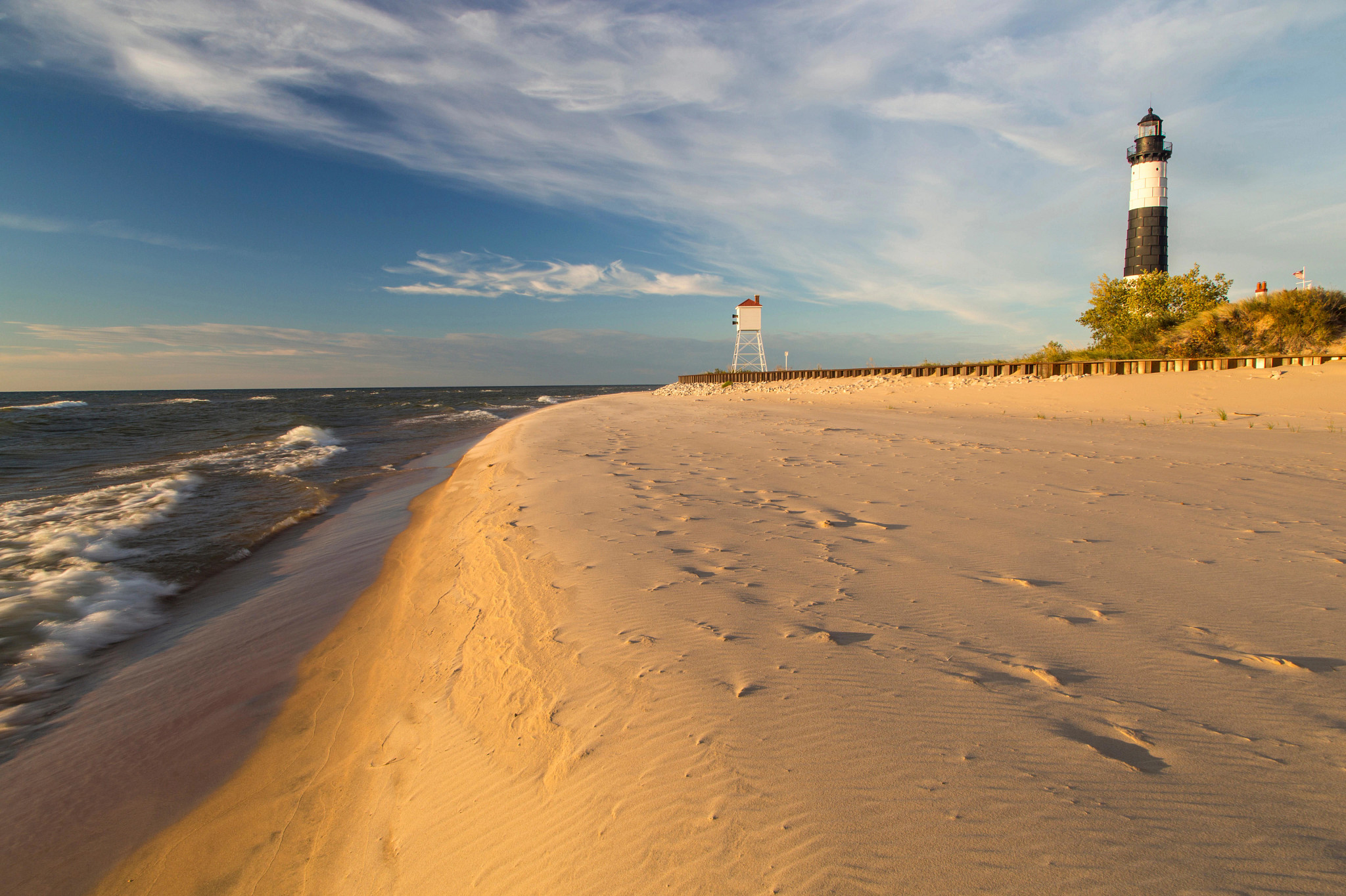 a beach with a lighthouse