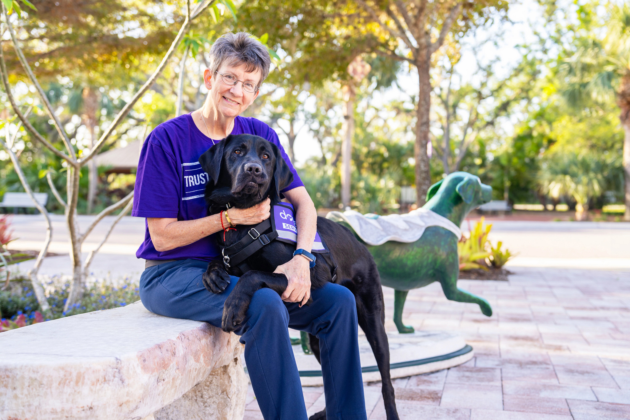 Jayne Tabb posing with her service dog Ace