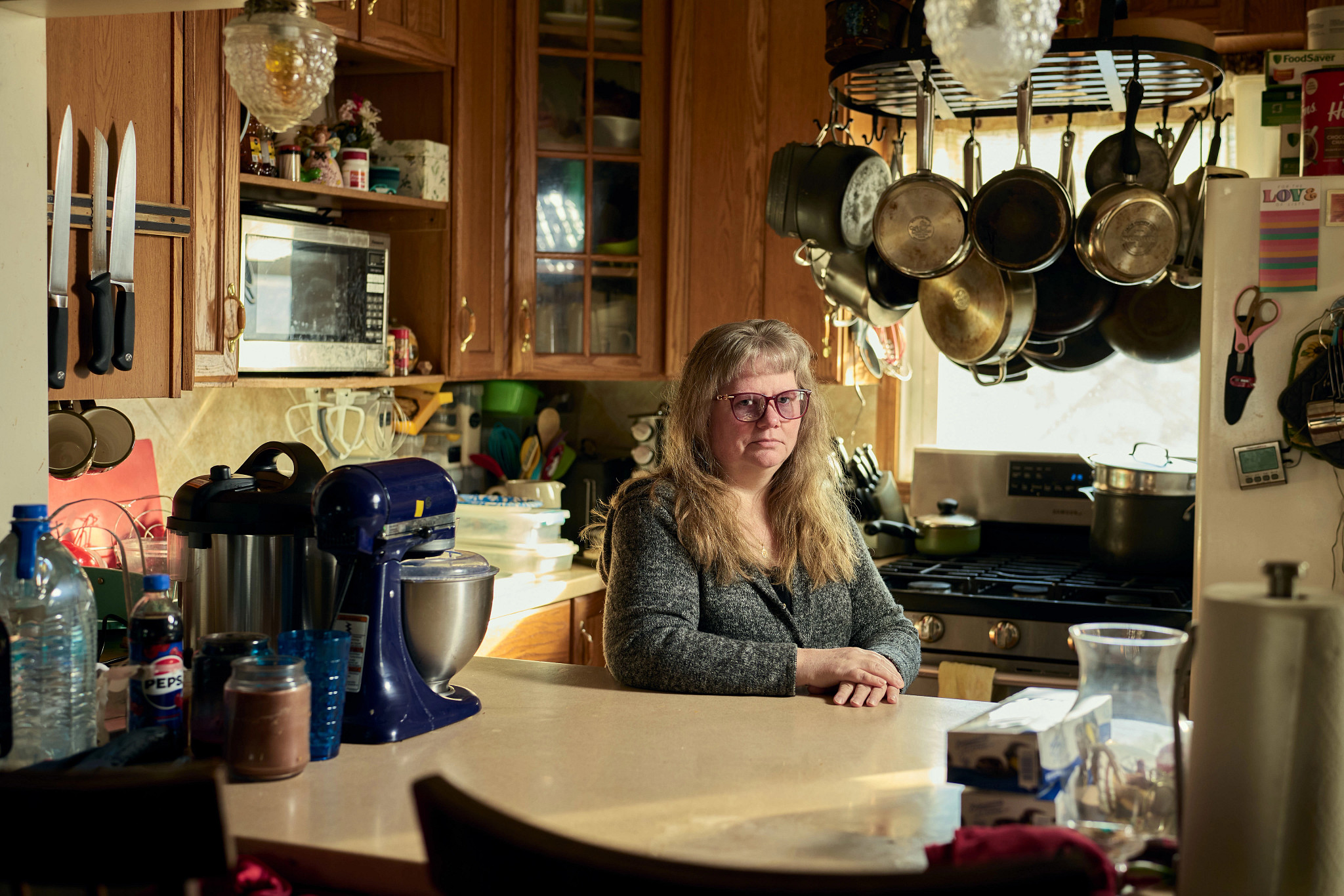 a person sitting in their kitchen