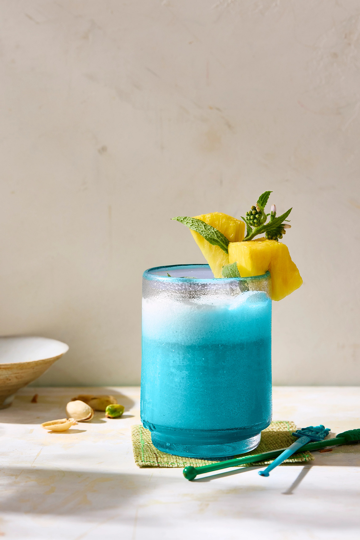 a blue Hawaii mocktail is shown in a photo