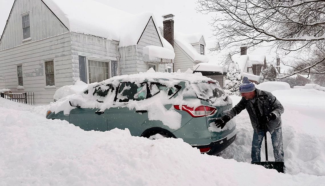 a Buffalo resident tries to extricate his vehicle from snow