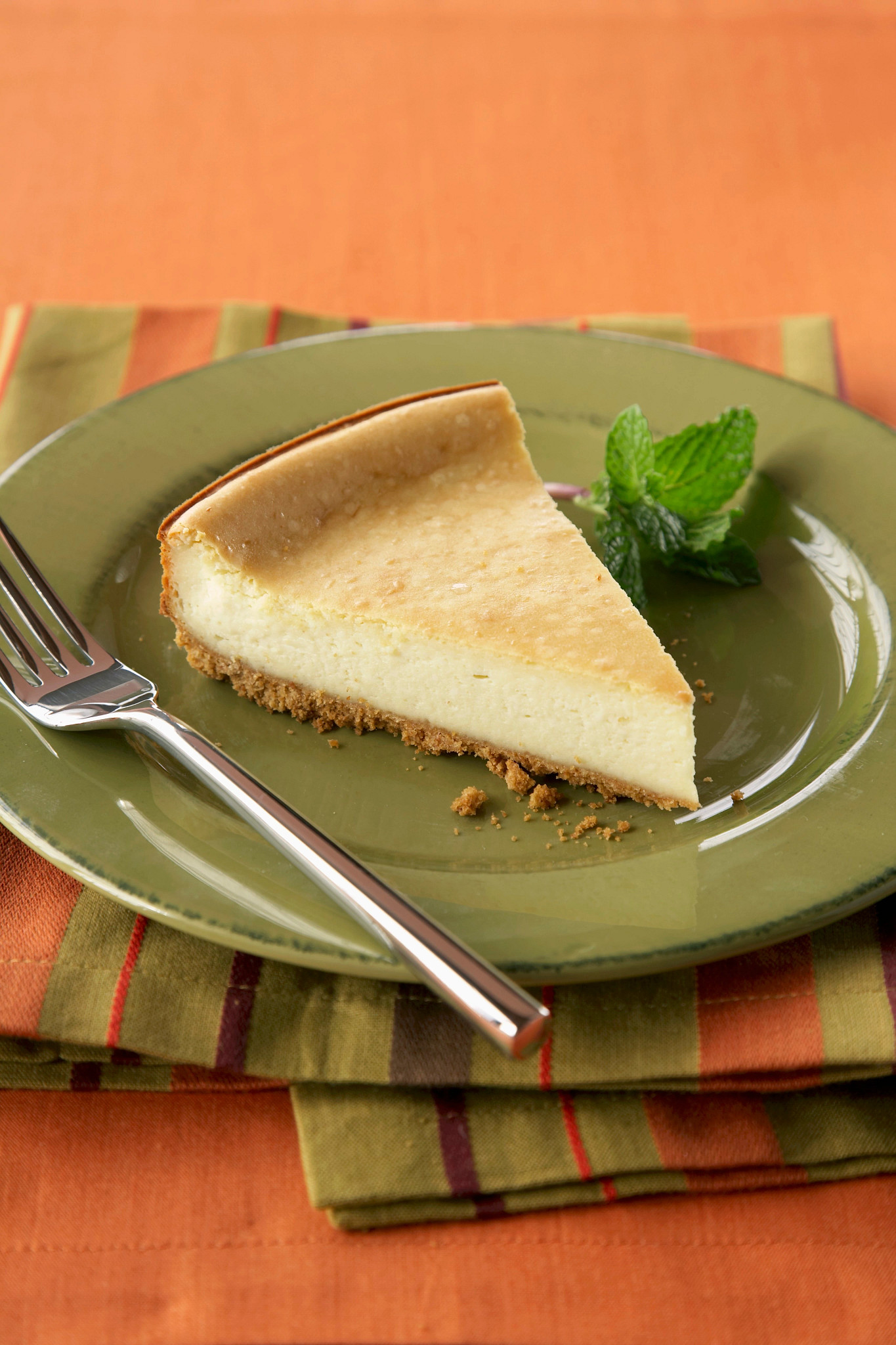 a photo shows a slice of plain cheesecake
