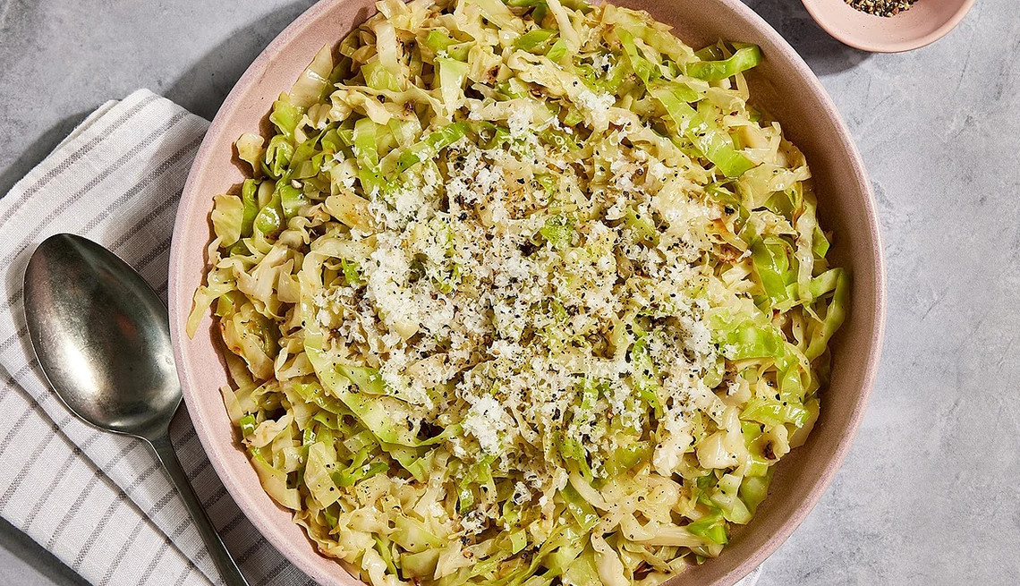 A close-up view of cacio e pepe sautéed cabbage in a bowl