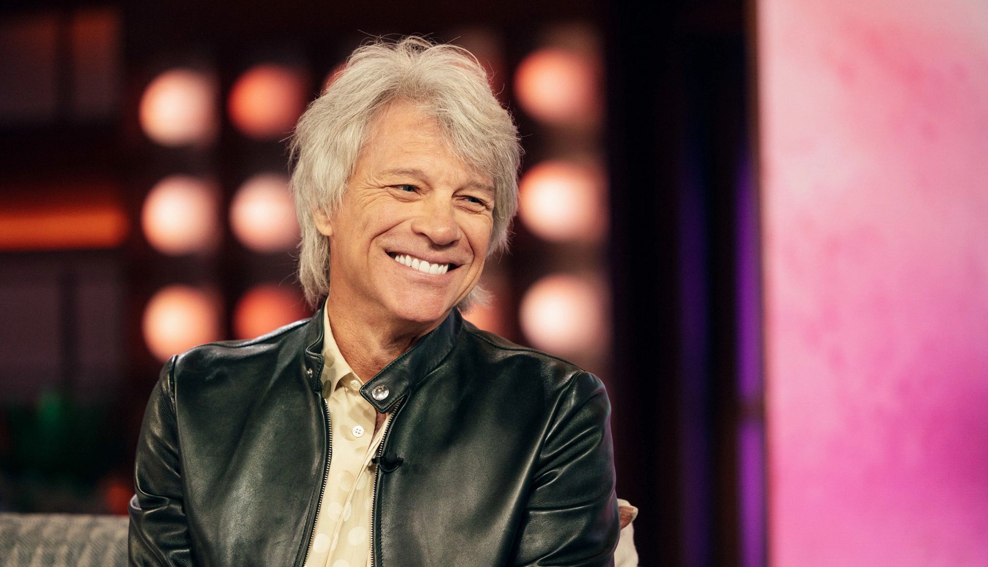 Jon Bon Jovi is Rocking His New Granddad Role jon bon jovi smiling during an interview