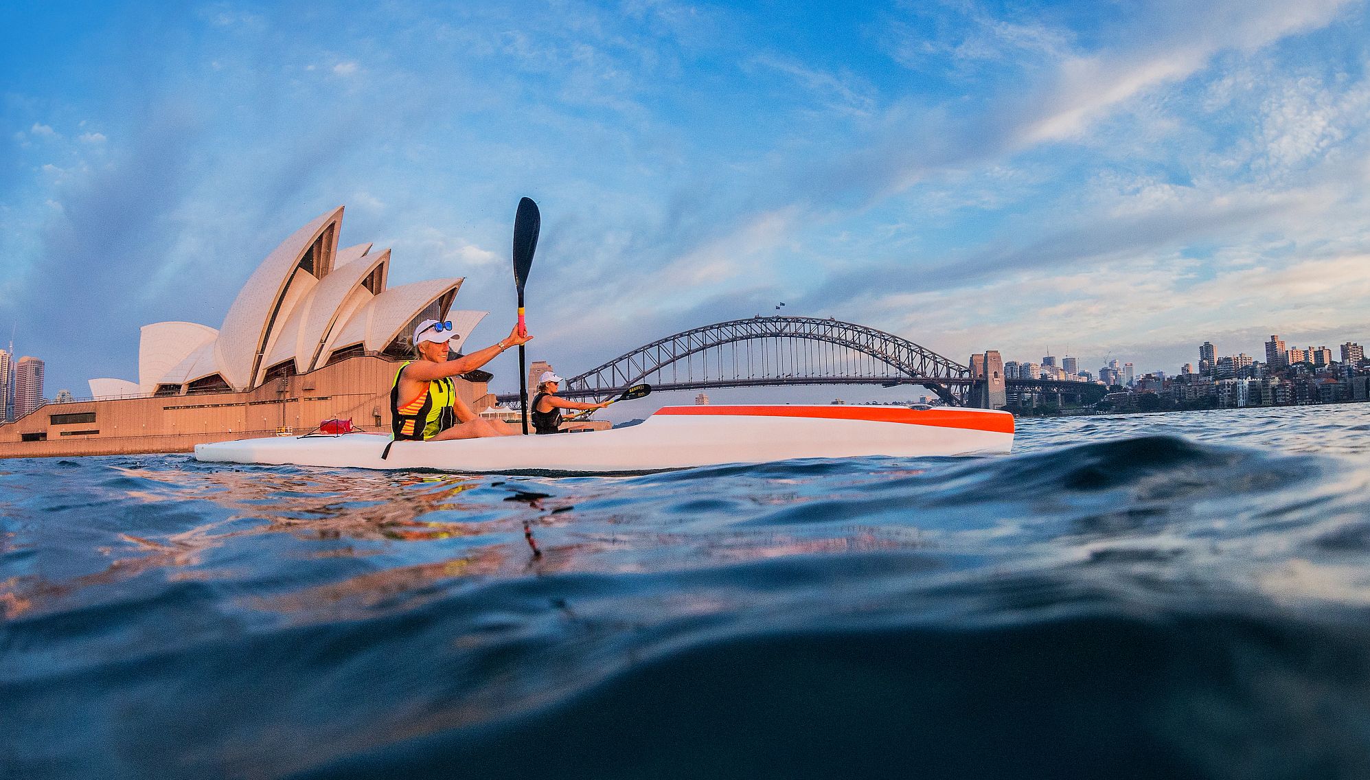 women kayaking on sydney harbour in summer