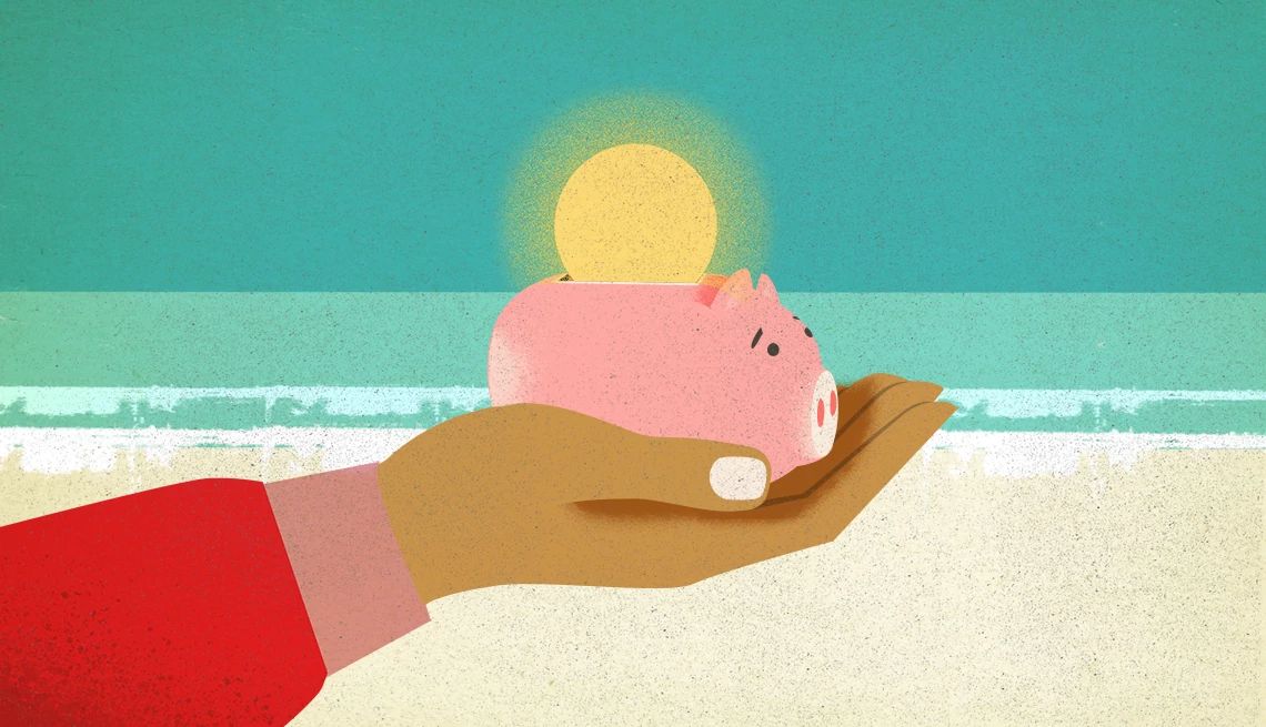 a person holding a piggy bank on a beach with the sun in the background