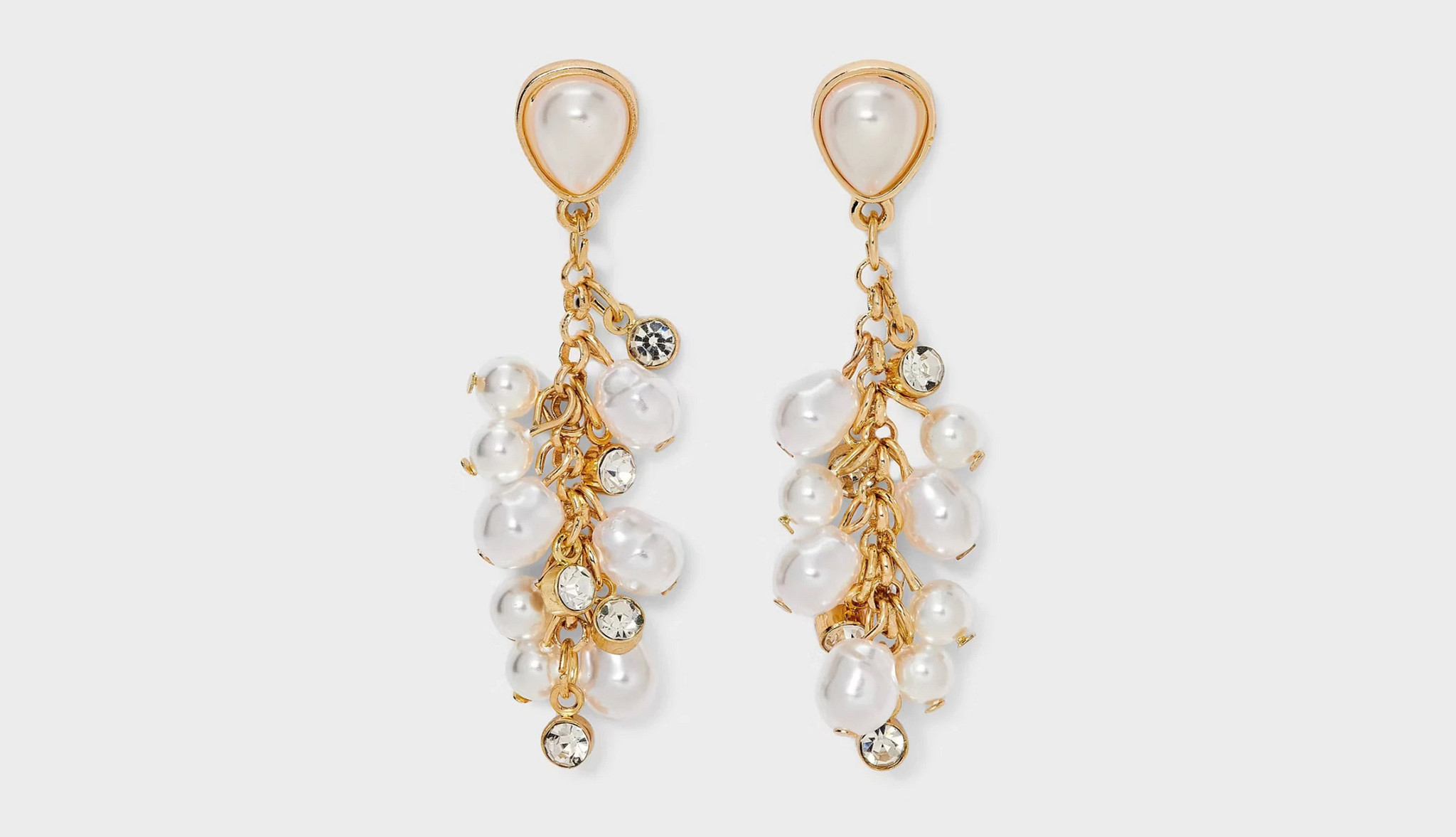 A pair of pear and gold drop earrings.