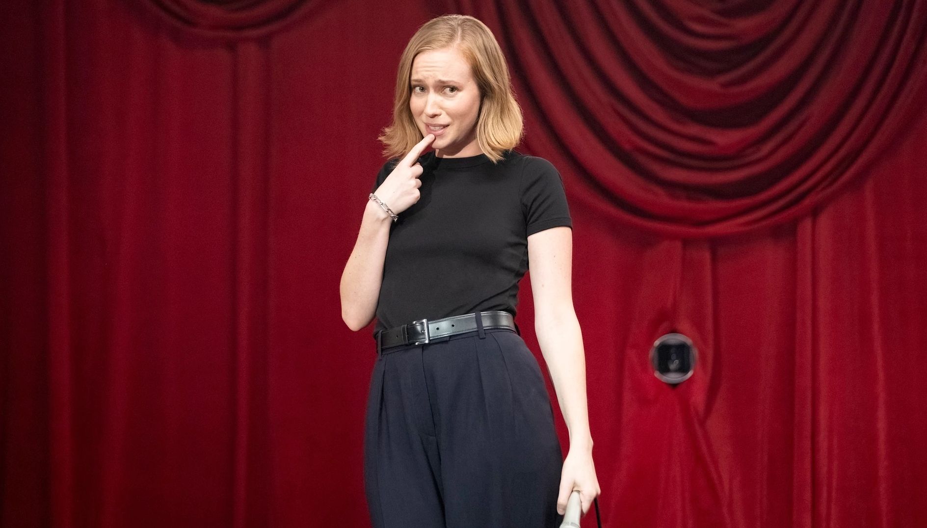 Hannah Einbinder places her finger on her chin during her HBO special Hannah Einbinder: Everything Must Go