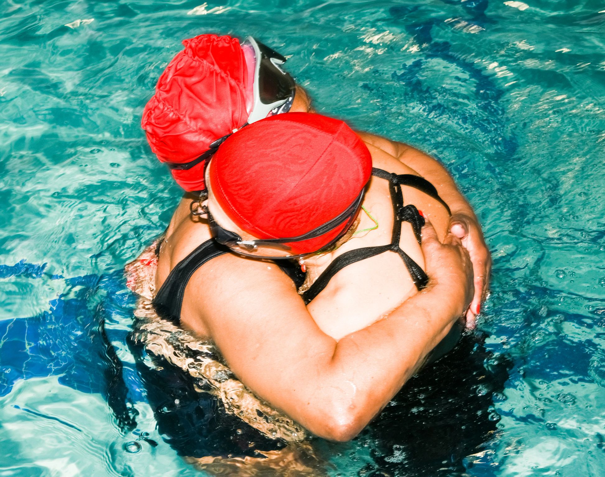 Water Ballet with a Purpose A photo shows Harlem Honeys and Bears members Barbara Eison White (on the left) and Jeanne Nedd embracing in the pool.