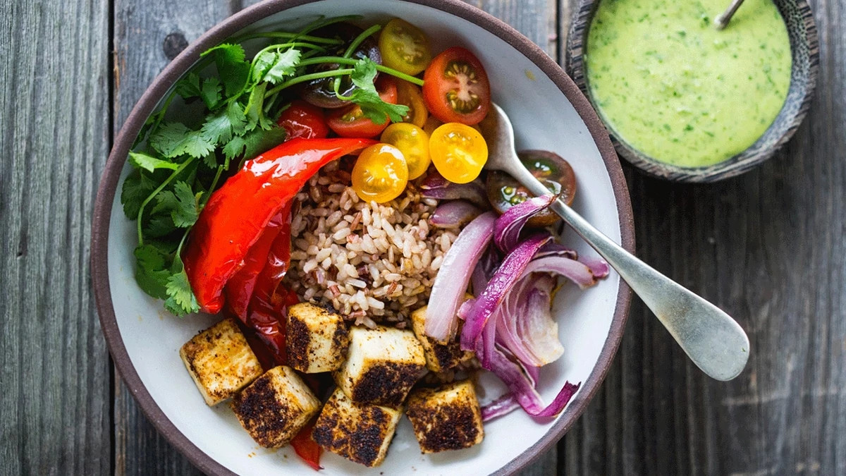 https://aarp.widen.net/content/eyt6nenzck/jpeg/1140-tofu-roasted-vegetable-grain-bowl.jpg?crop=true&anchor=13,0&q=80&color=ffffffff&u=xp0vsk&w=1175&h=675