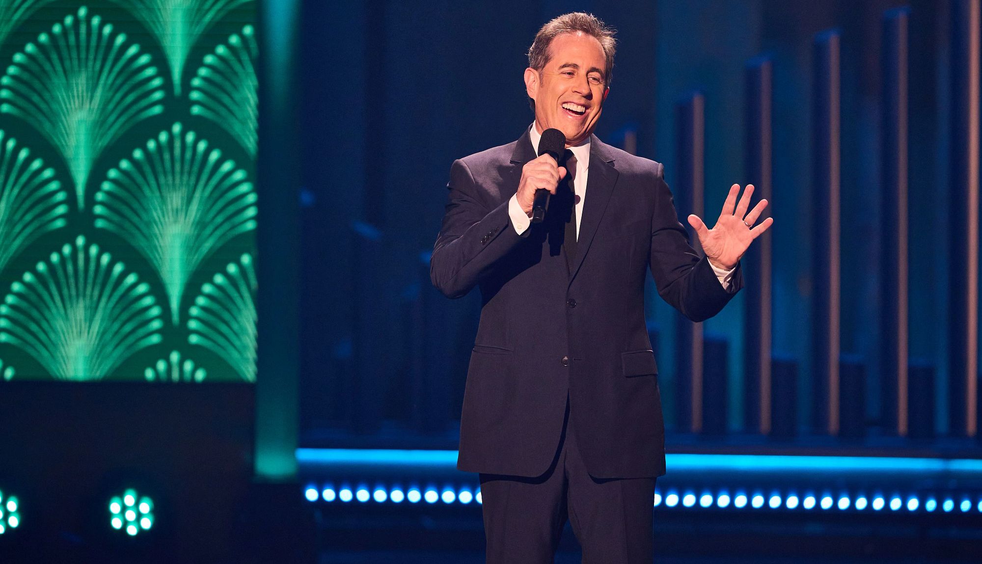 Jerry Seinfeld at the 25th Annual Mark Twain Prize For American Humor honoring Kevin Hart Jerry Seinfeld talking into a microphone onstage at the 25th Annual Mark Twain Prize For American Humor