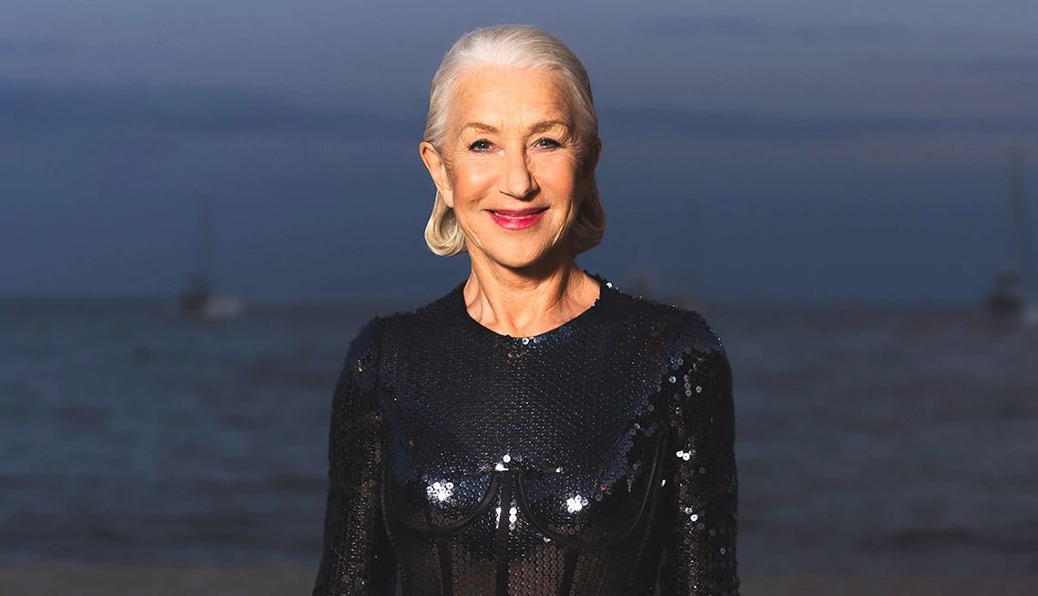 Helen Mirren’s Secrets to Life, Love and Happiness Helen Mirren in front of blurred body of water under blue sky