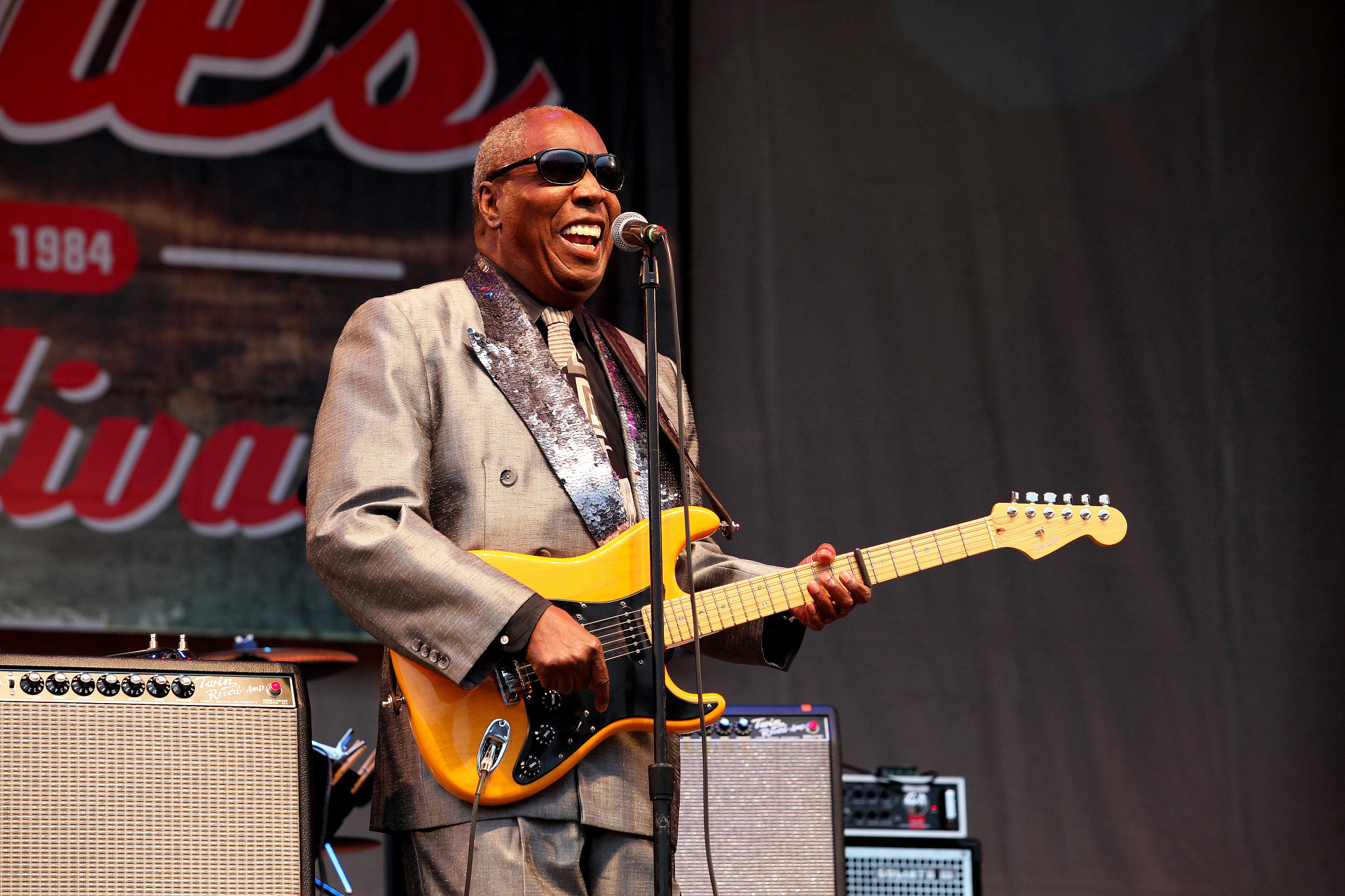 clarence carter performing onstage with his guitar