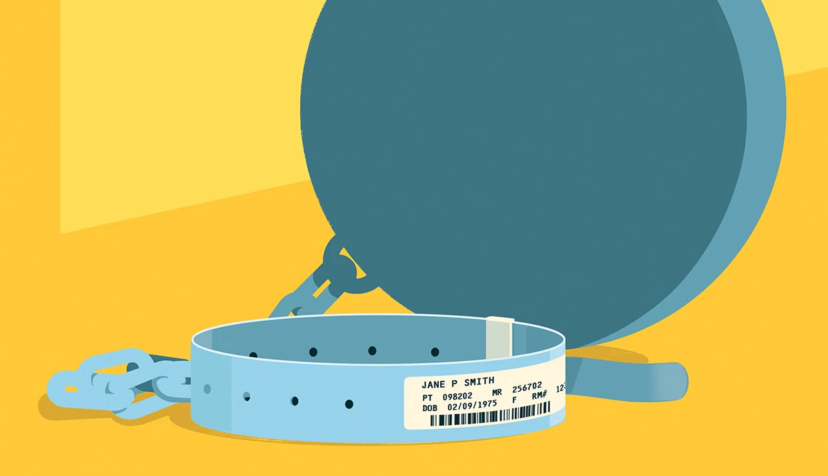a hospital wristband tied to a heavy weighted ball
