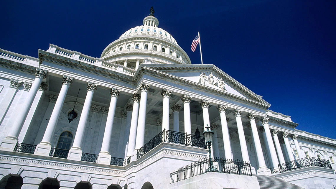 Front of government building looking up with blue sky in background