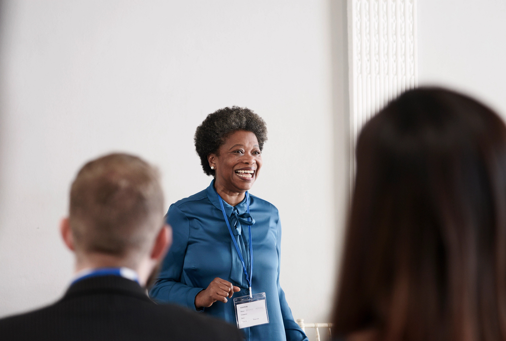 a woman giving a presentation 