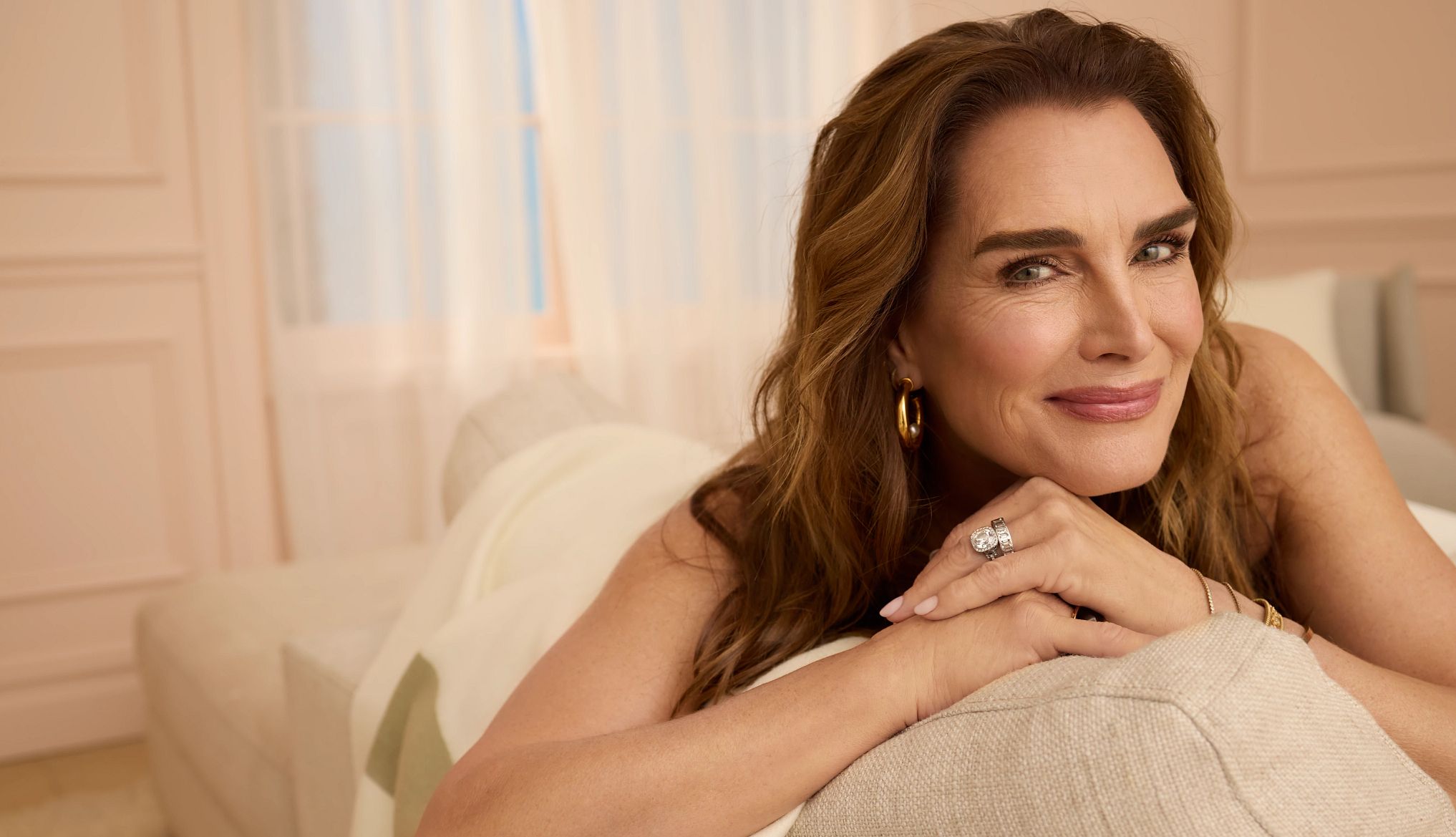 Actress Brooke Shields sitting on a sofa Actress Brooke Shields sitting on a sofa