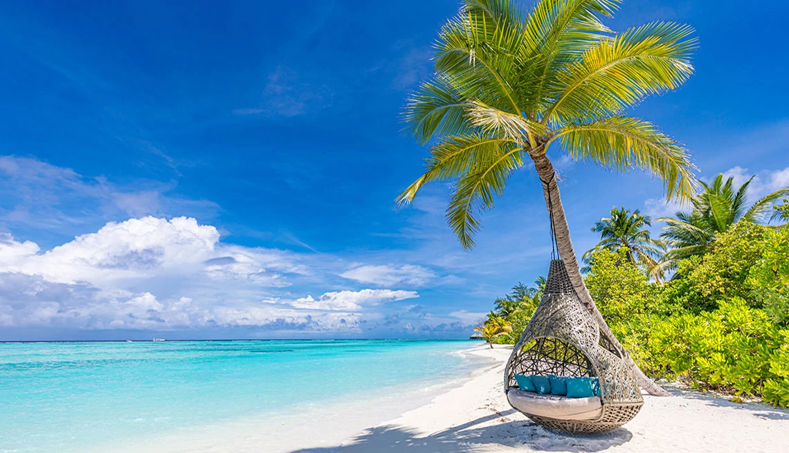 Tropical beach background as summer landscape with beach swing