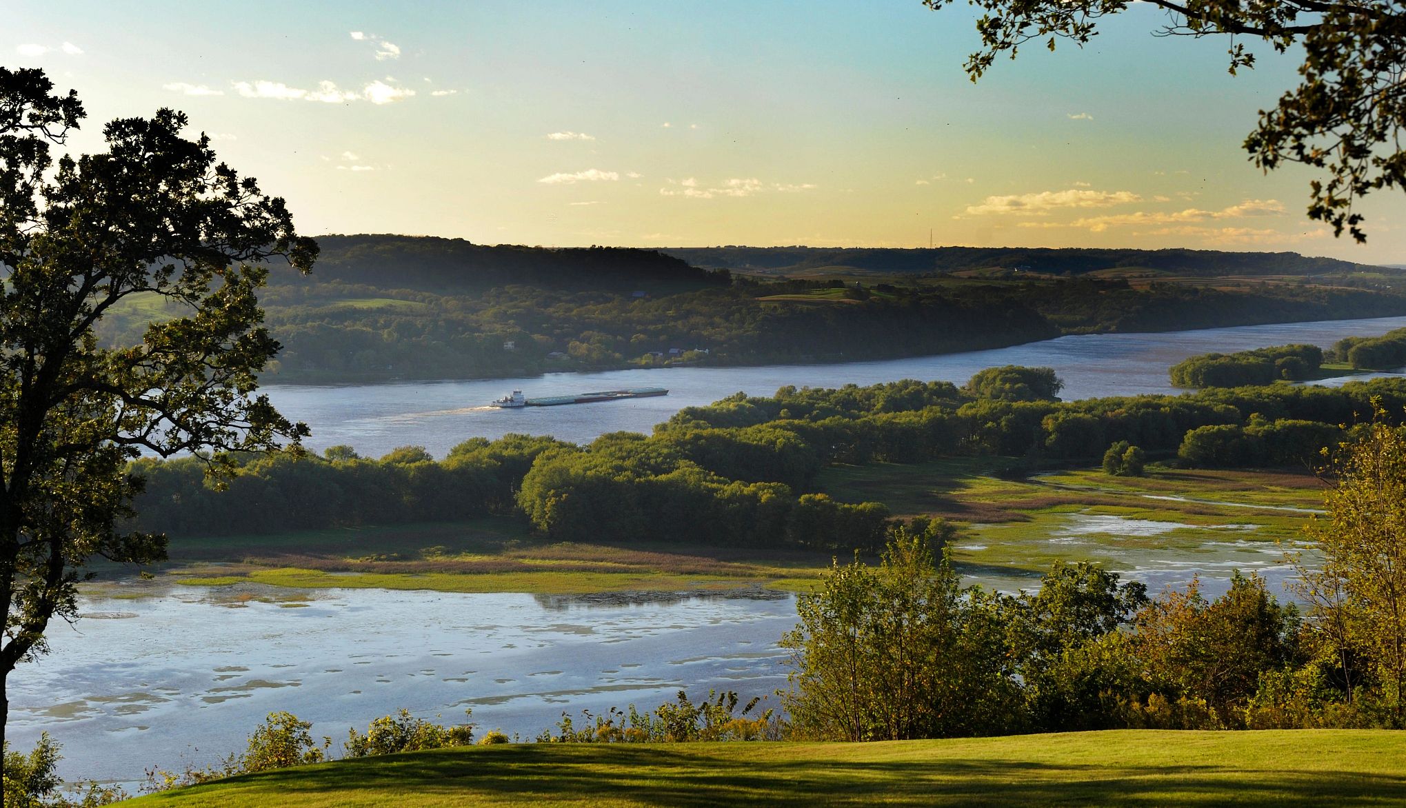Affordable U.S. Destinations a boat traveling down the mississippi river