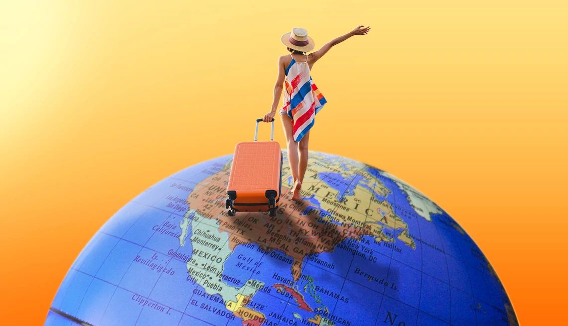 Smart guide to solo travel Woman facing away from camera, walking on globe, wheeling suitcase with left hand, right hand in air