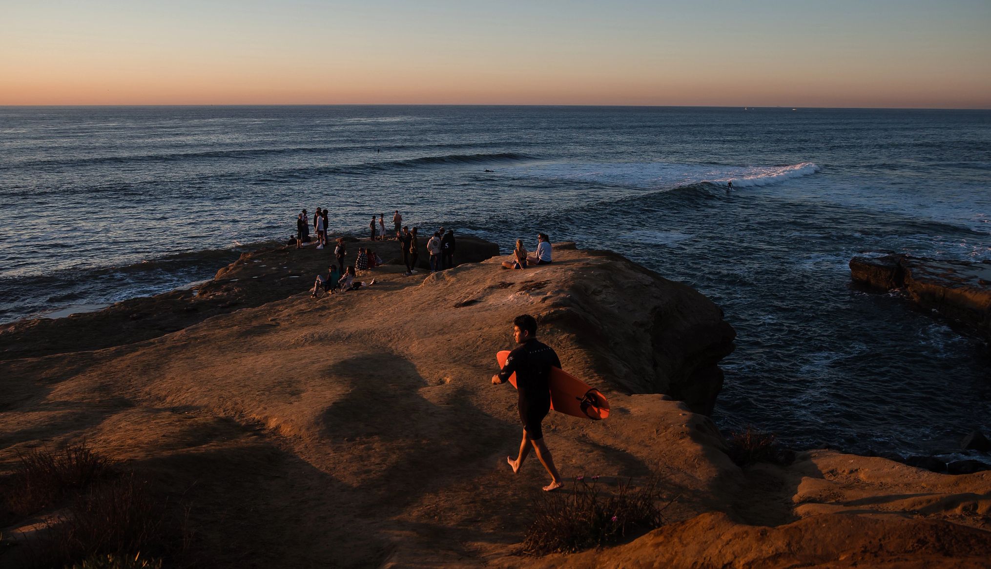 Carlsbad Desalination Plant is a great spot for surfing A surfer walks towards the beach at Sunset Cliffs in San Diego, just down the coast from the Carlsbad Desalination Plant