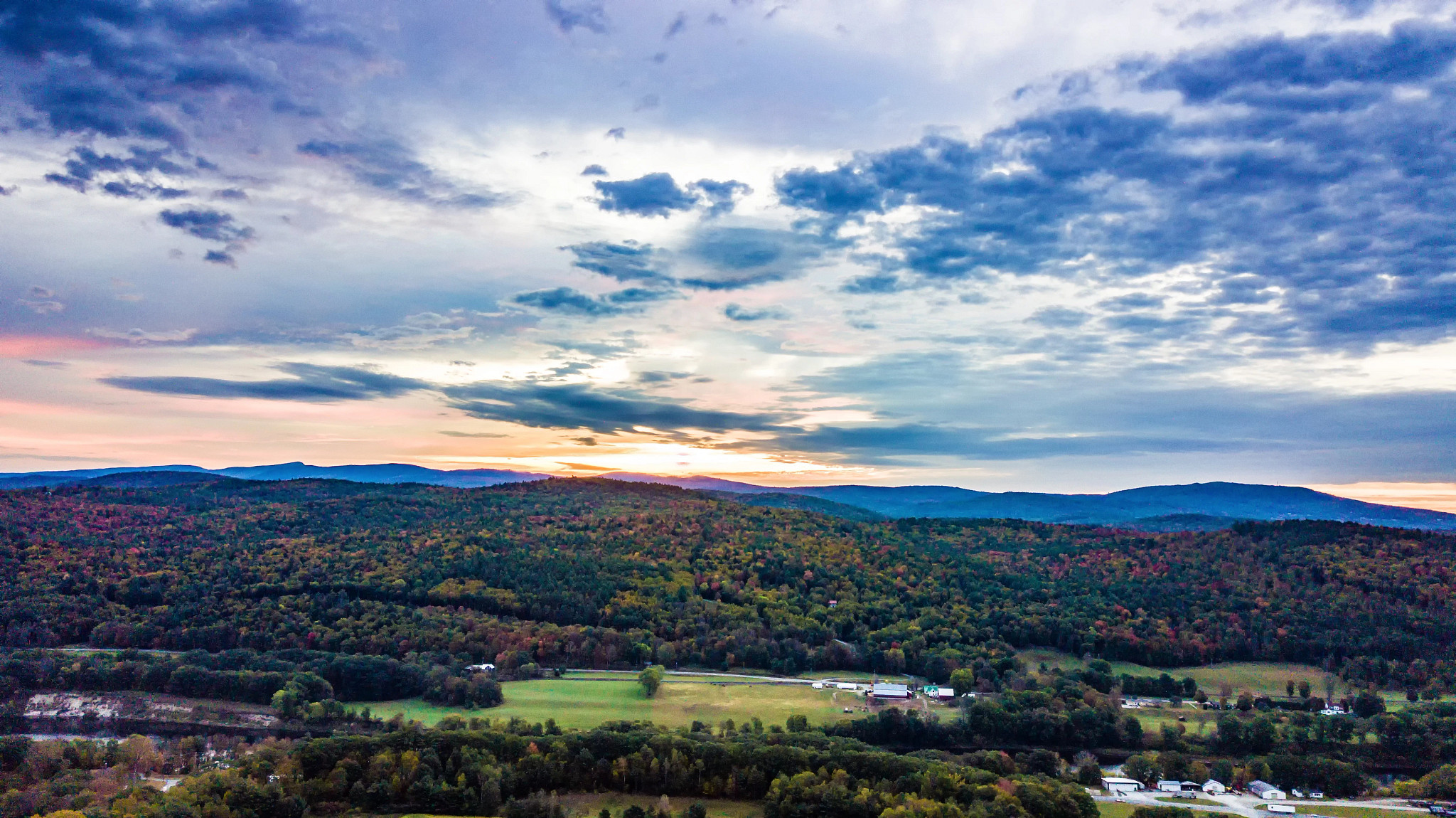 Scenic View Of Landscape Against Sky During Sunset