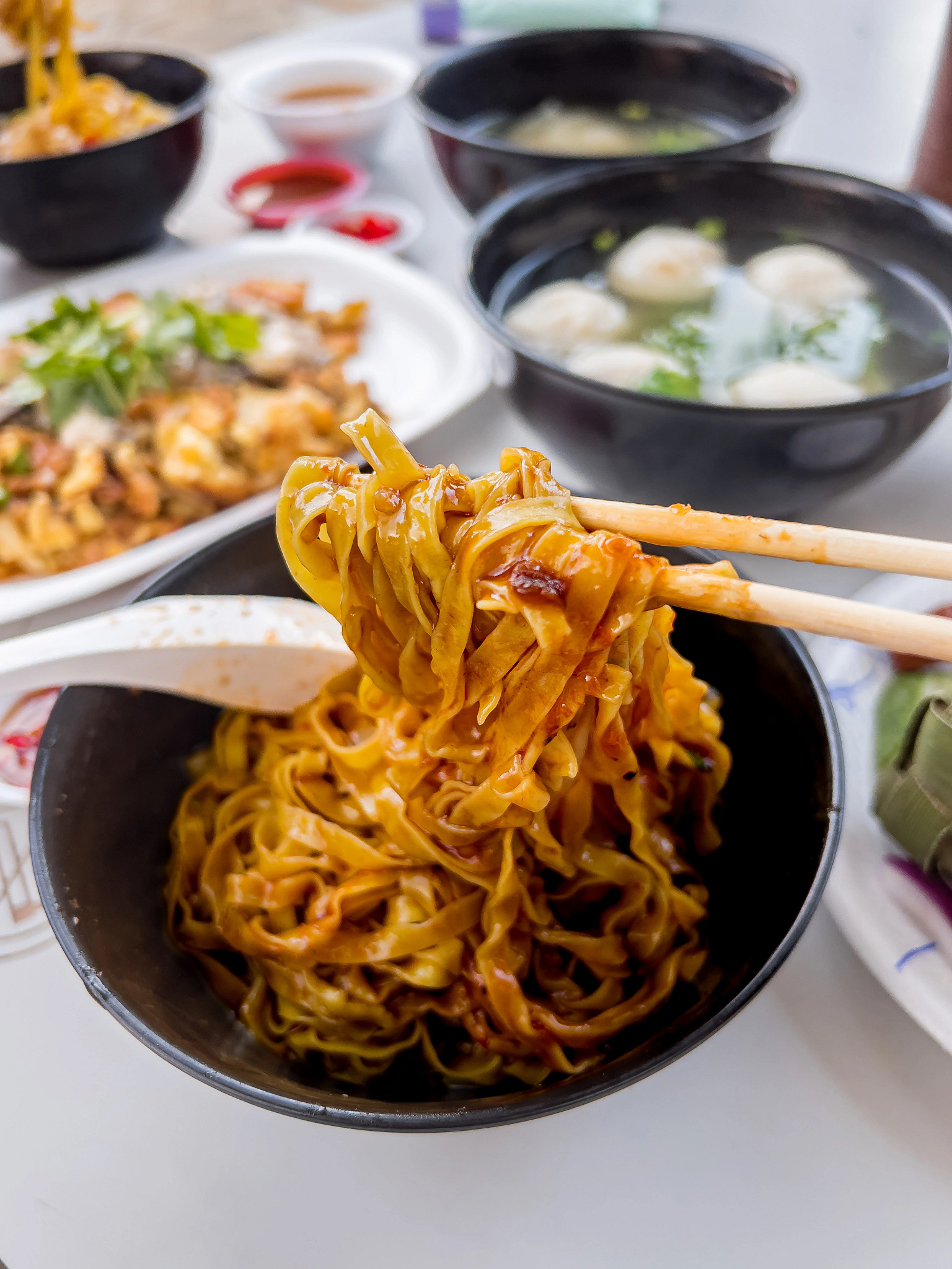 a bowl with mee pok noodles