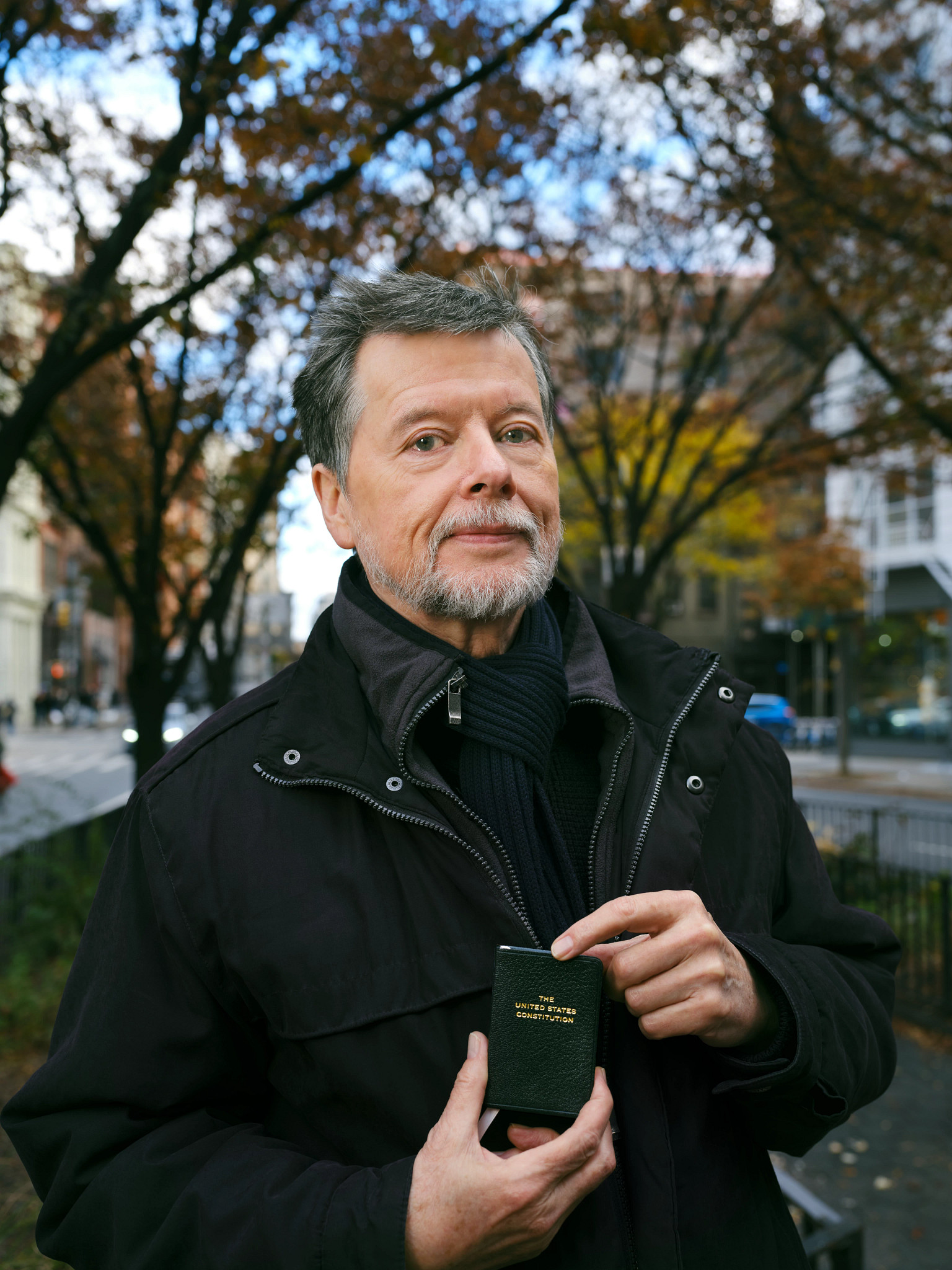 ken burns holding a pocket size copy of the united states constitution