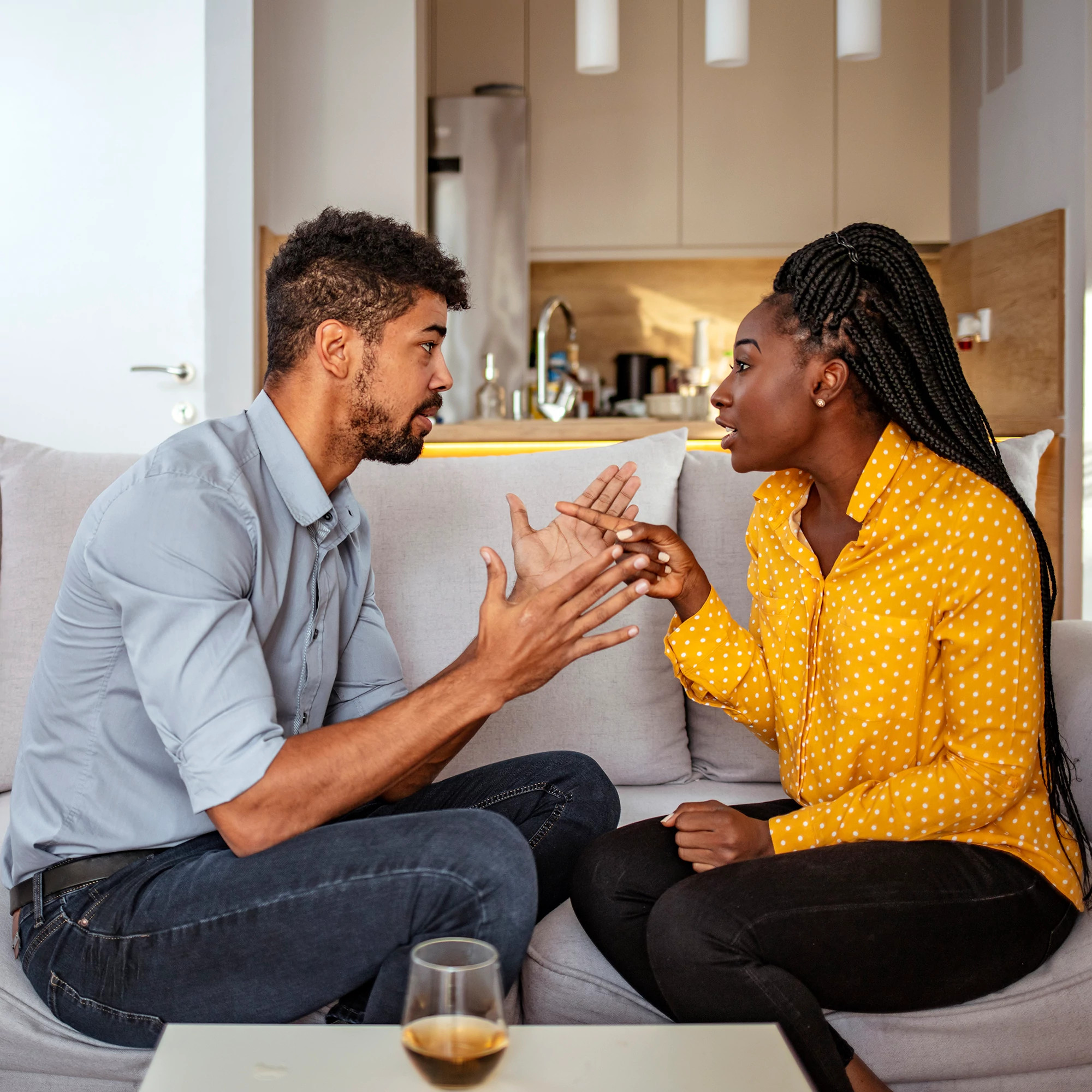 Black woman and man quarreling at home