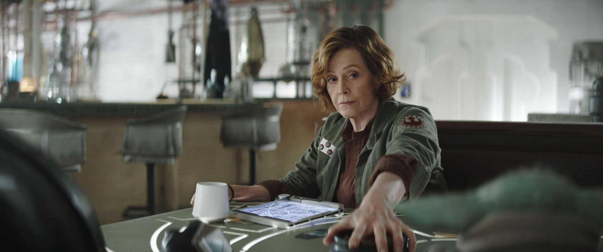 sigourney weaver in a scene from the mandalorian and grogu