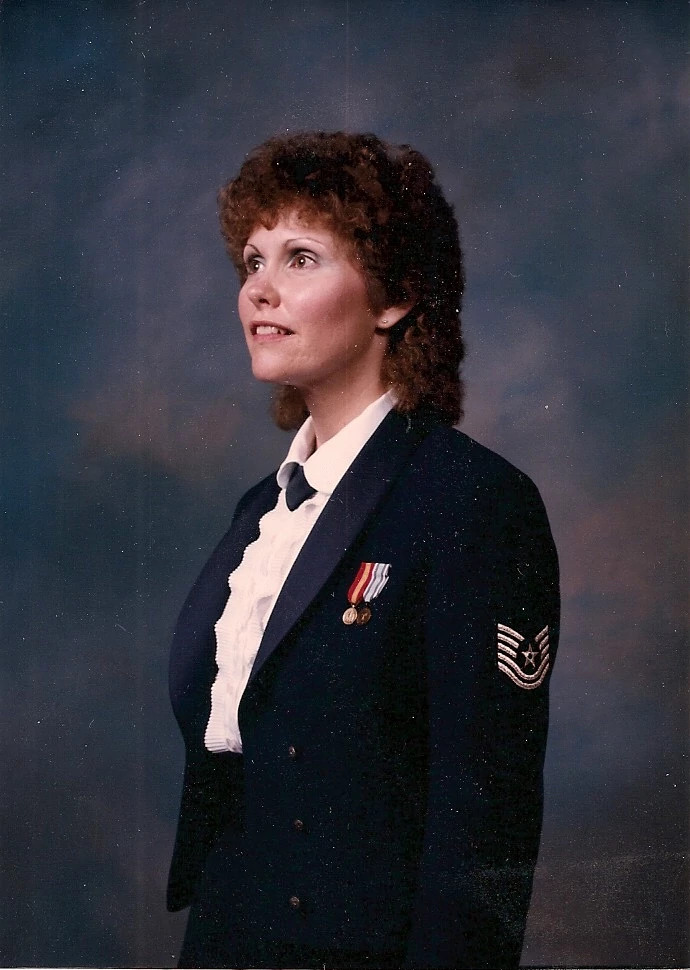 margaret rhodes posing for a portrait in her air force dress uniform