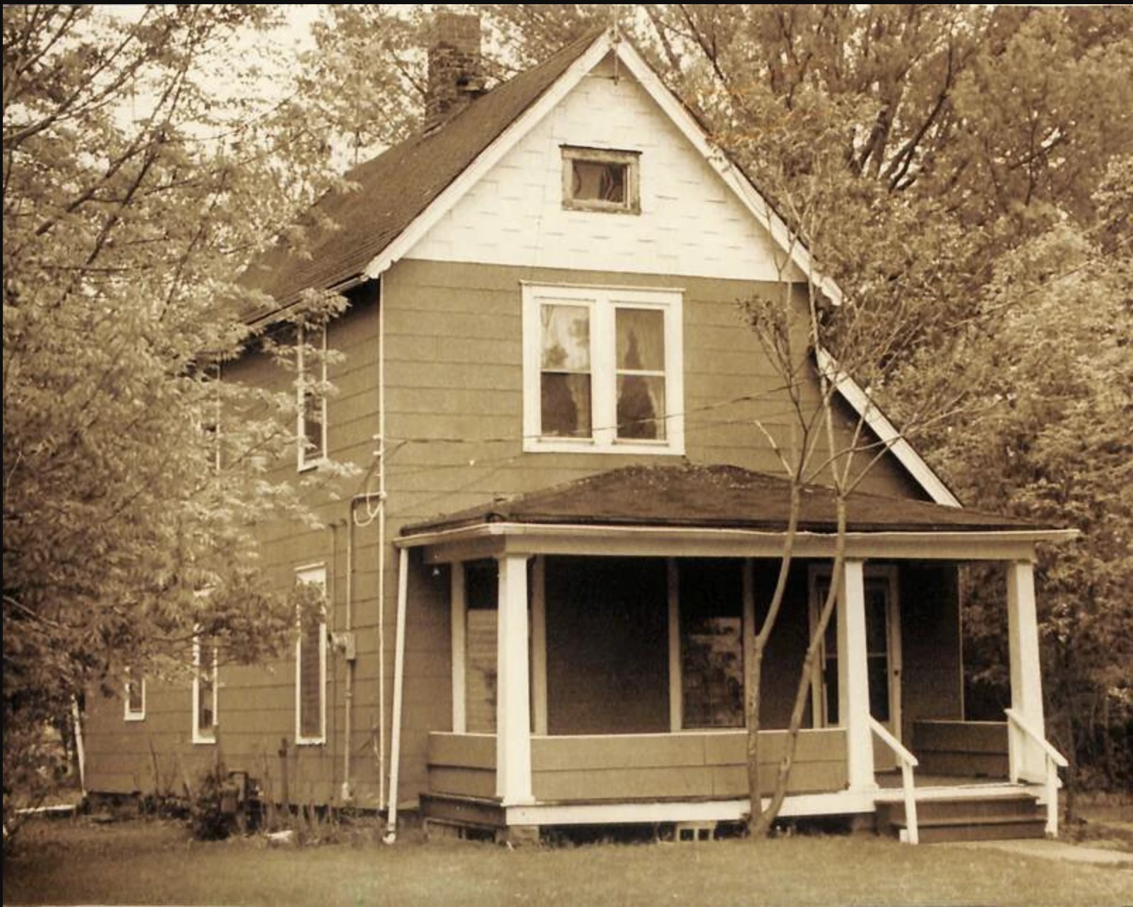 a black and white photo of a house