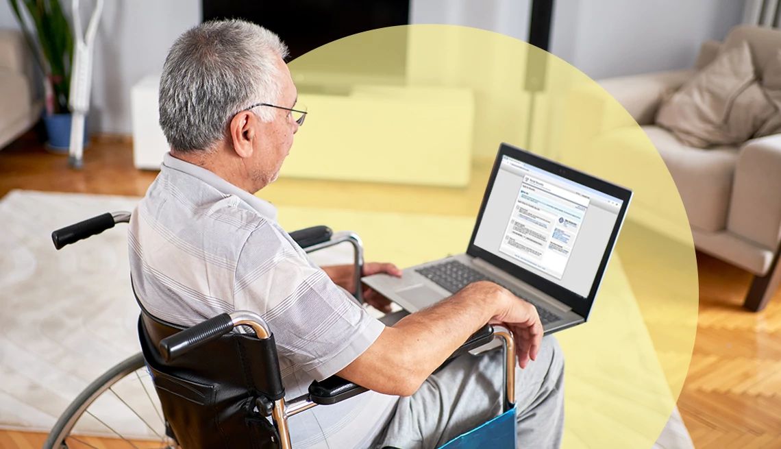 Social Security Rolling Out Online Application for SSI a man in a wheelchair looking at his laptop