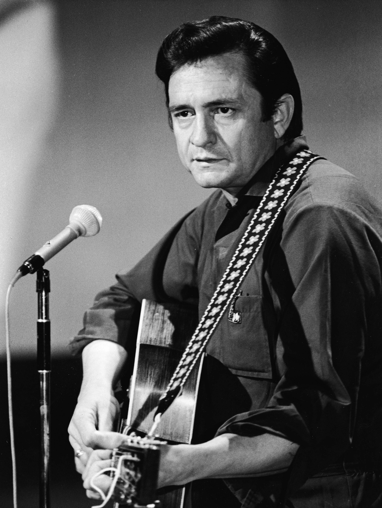 Johnny Cash playing a guitar