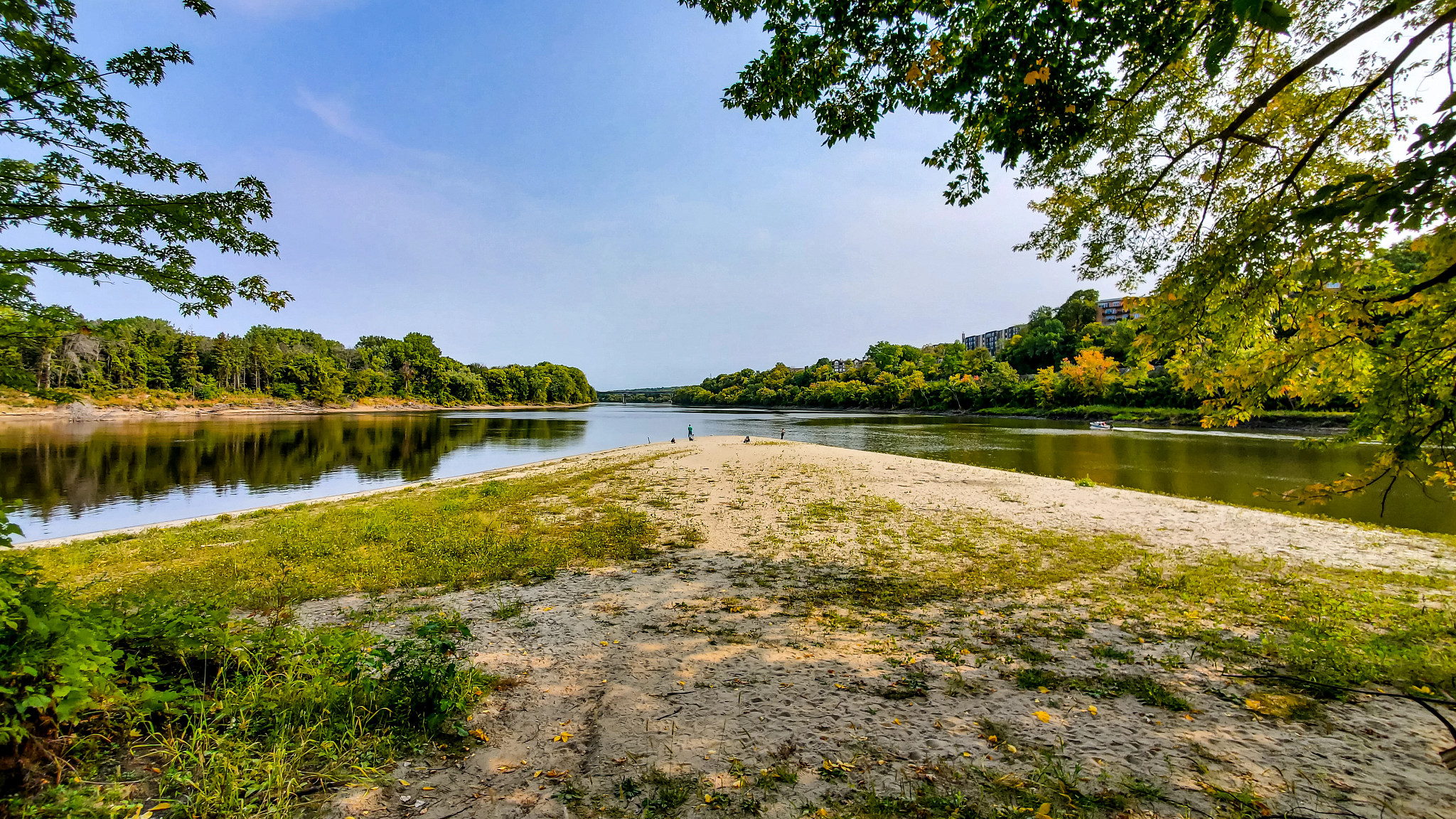 people standing on the shore where the mississippi and minnesota rivers meet