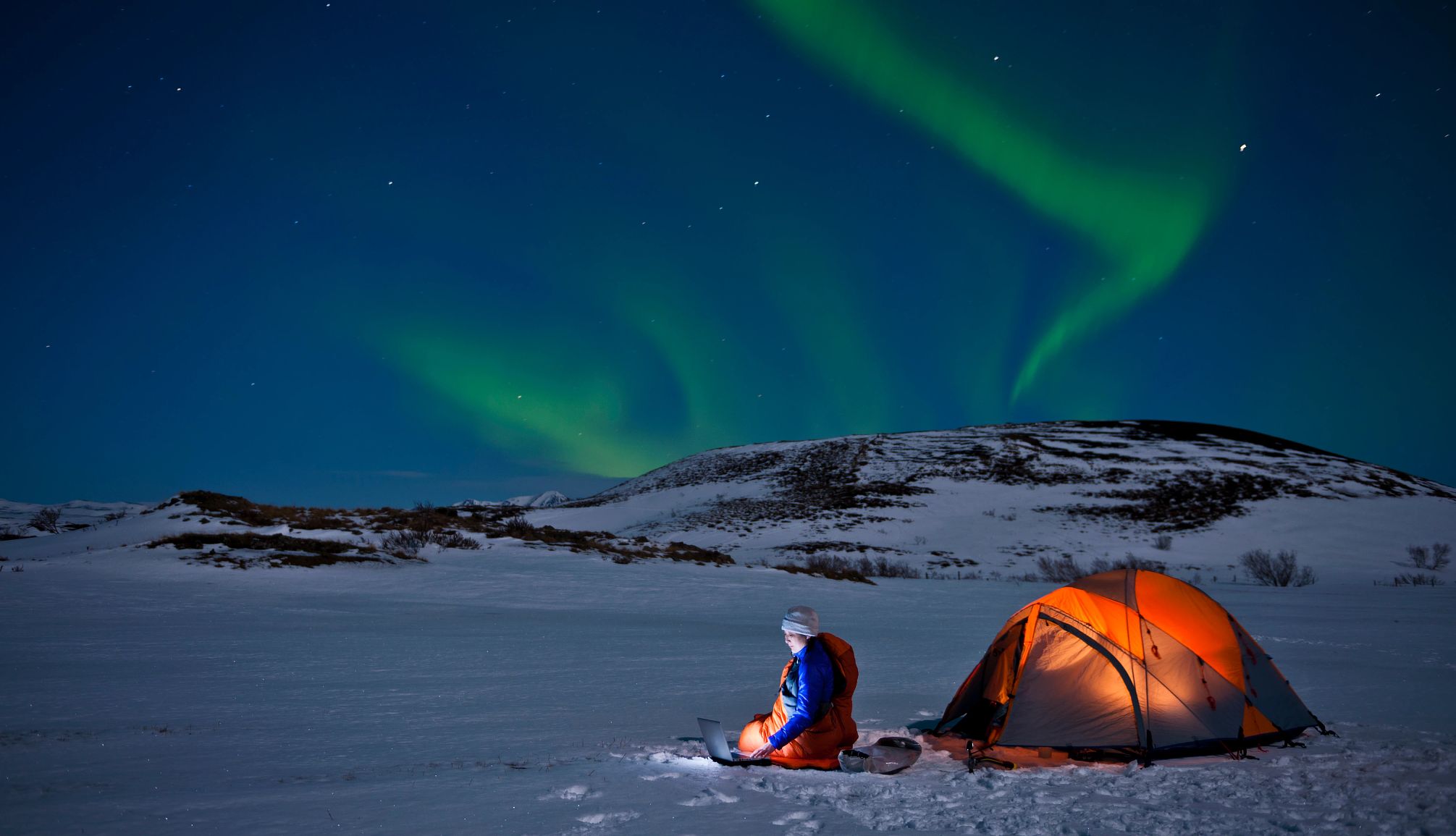 The Northern Light Inn is near the Blue Lagoon a person in a tent in Iceland