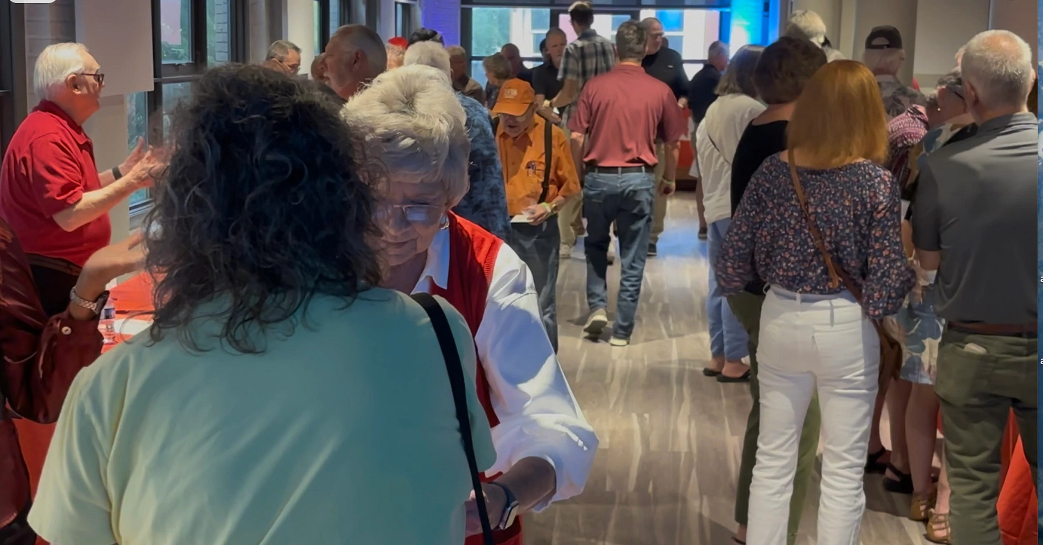About 100 people turned out to learn how to protect themselves from fraud while tasting wine and playing pinball.