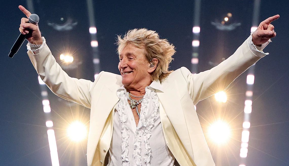 Rod Stewart Cancels Shows as He Fights the Flu Rod Stewart holding a microphone while performing