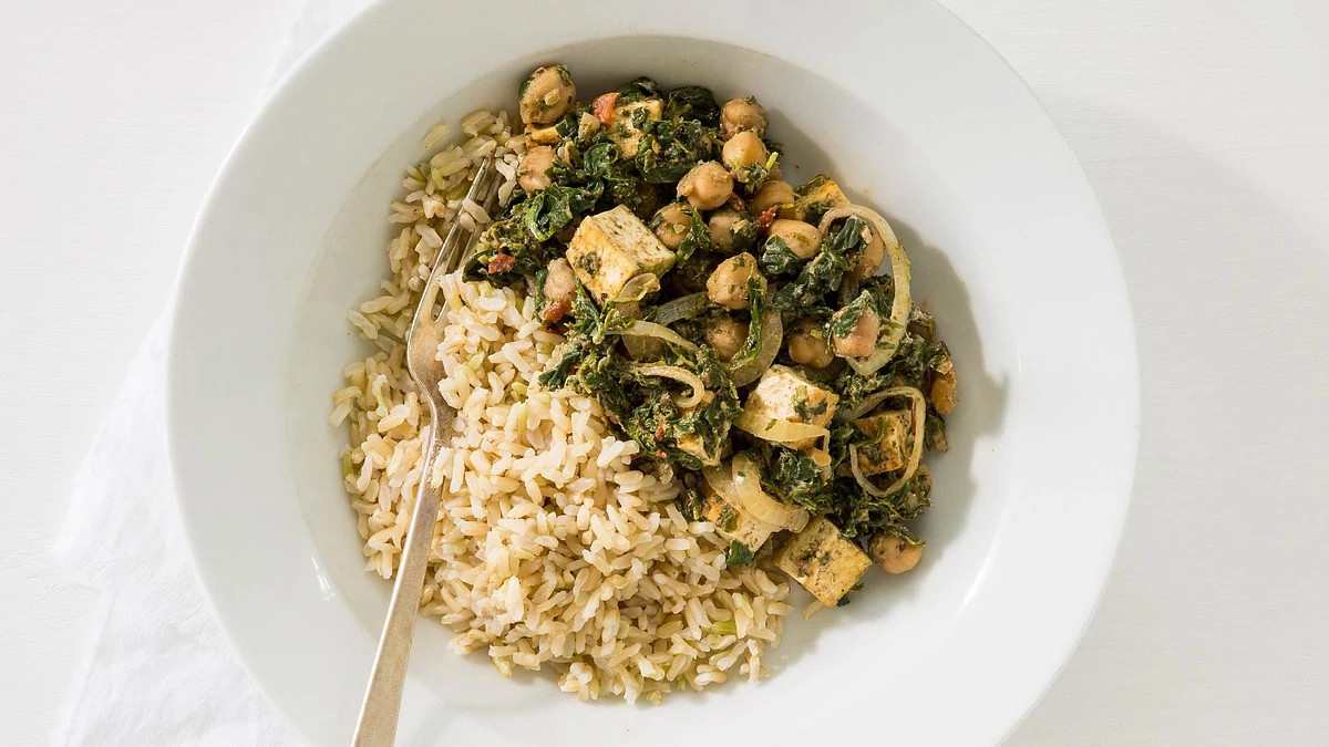 A close-up view of Indian saag with chickpeas on a plate