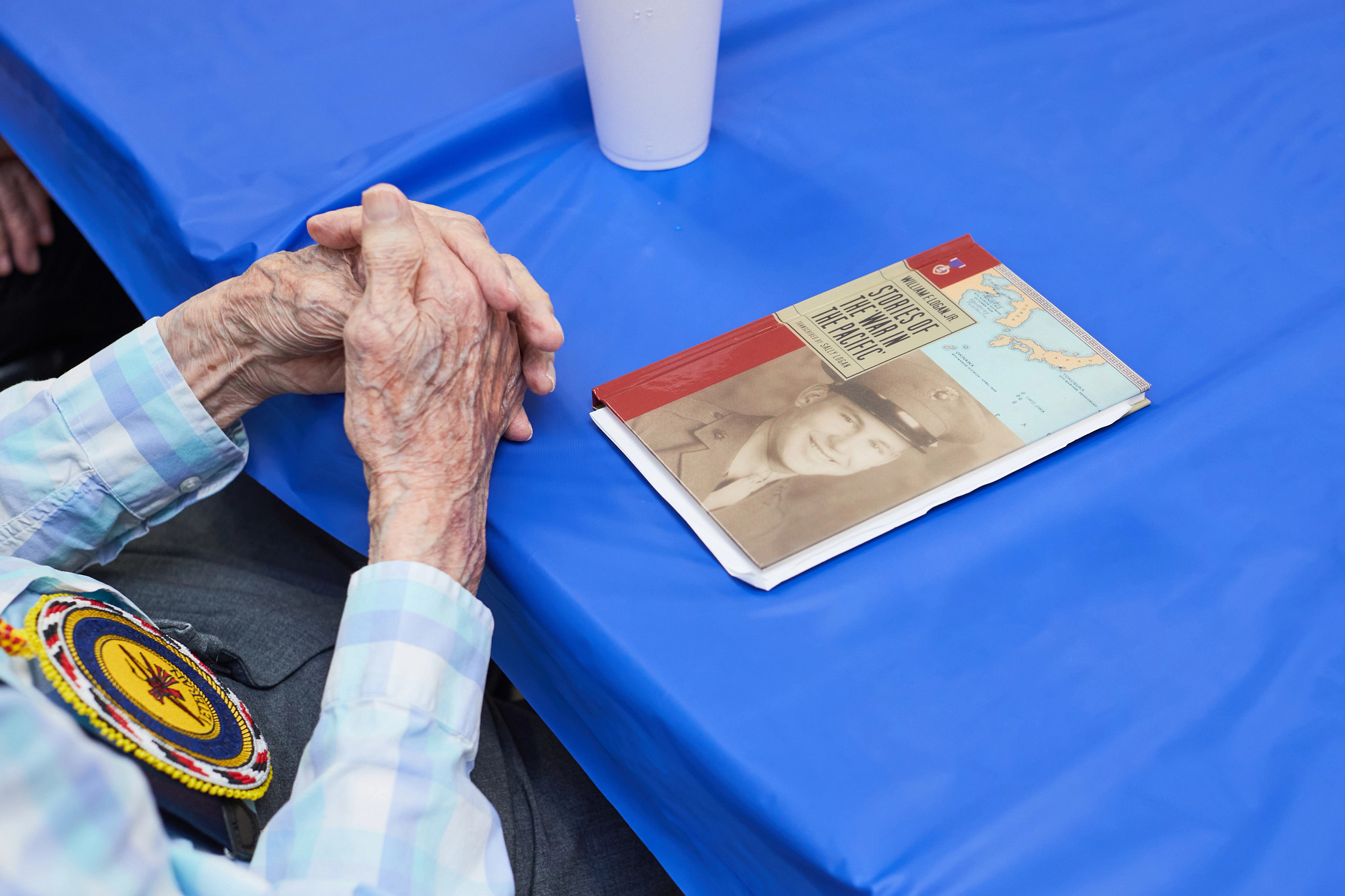 a book about William Logan lying on a table